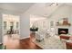 Inviting living room with vaulted ceilings, fireplace, and an open layout to the dining area at 215 Nina Circle Cir, Locust Grove, GA 30248