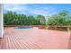 Spacious wooden deck surrounding an above-ground pool, perfect for outdoor entertainment and relaxation at 215 Nina Circle Cir, Locust Grove, GA 30248