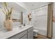 This modern bathroom boasts a large mirror, vanity, and shower-tub combo, with stylish decor at 216 Paisley Way, Locust Grove, GA 30248