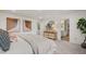 Bright bedroom featuring stylish decor, carpet flooring and a comfortable king-sized bed at 216 Paisley Way, Locust Grove, GA 30248