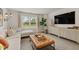 Cozy living room featuring a comfortable sectional and modern decor at 216 Paisley Way, Locust Grove, GA 30248