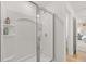 Bright shower featuring a sliding glass door and built-in shelving at 216 Paisley Way, Locust Grove, GA 30248