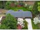 An aerial view of the home nestled among mature trees and landscaping at 3755 Kayanne Ct, Tucker, GA 30084