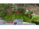 Aerial shot of a house with greenery all around; a well maintained lawn and a beautiful landscape at 3755 Kayanne Ct, Tucker, GA 30084