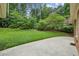 Spacious backyard featuring a lush lawn with mature trees, ready for outdoor activities and relaxation at 3755 Kayanne Ct, Tucker, GA 30084