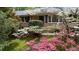 Inviting brick home with manicured lawn and vibrant azaleas enhancing curb appeal at 3755 Kayanne Ct, Tucker, GA 30084