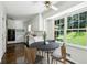 Bright kitchen boasts stainless appliances, white cabinetry, and eat-in breakfast nook with backyard views at 3755 Kayanne Ct, Tucker, GA 30084