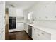 Spacious kitchen featuring white cabinets, stainless steel appliances and ample counter space at 3755 Kayanne Ct, Tucker, GA 30084