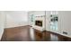 Cozy living room with hardwood floors and a decorative fireplace, perfect for relaxation and entertaining guests at 3755 Kayanne Ct, Tucker, GA 30084