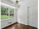 Inviting living space featuring hardwood floors and large windows offering plenty of natural light at 3755 Kayanne Ct, Tucker, GA 30084