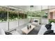 Relaxing screened-in porch with comfortable seating and a view of the private backyard at 3755 Kayanne Ct, Tucker, GA 30084