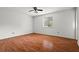 Spacious bedroom with laminate flooring, neutral walls, and a window offering natural light at 140 Carriage Cir, Stockbridge, GA 30281