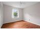 Bedroom with laminate floor and a window with curtains, and a closet at 140 Carriage Cir, Stockbridge, GA 30281