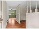 Inviting entryway with wood floors, neutral walls, and decorative spindles leading to other living spaces at 140 Carriage Cir, Stockbridge, GA 30281