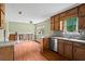 Traditional kitchen features wood cabinets, laminate countertops, and stainless steel dishwasher at 140 Carriage Cir, Stockbridge, GA 30281