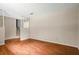 Open living room with hardwood floors, stairs to second floor and neutral walls, creating a serene space at 140 Carriage Cir, Stockbridge, GA 30281