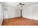 Laminate floored main bedroom with closet and bathroom access, and a ceiling fan at 140 Carriage Cir, Stockbridge, GA 30281