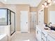 Modern bathroom with dual vanity, tiled shower, and soaking tub at 330 Meacham Ct, Dacula, GA 30019