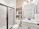 Modern bathroom with tiled walk-in shower, white vanity and updated fixtures at 330 Meacham Ct, Dacula, GA 30019