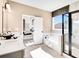 Bathroom featuring separate shower and tub with bright natural light at 330 Meacham Ct, Dacula, GA 30019