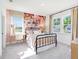 Bright bedroom with an abstract mural, stylish decor, and large windows with lots of light at 330 Meacham Ct, Dacula, GA 30019