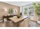Dining room with views of home exterior and modern table at 330 Meacham Ct, Dacula, GA 30019