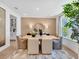 Cozy dining room featuring a large table, neutral decor, and natural light from a large window at 330 Meacham Ct, Dacula, GA 30019