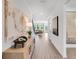 Hallway features wood flooring, modern lighting, with art on the walls at 330 Meacham Ct, Dacula, GA 30019