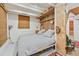 Cozy bedroom featuring a wood slat headboard and rustic decor with an ensuite entrance at 3620 Beaver Cove Rd, Cumming, GA 30041