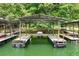 Spacious covered dock with multiple boat slips on a tranquil lake setting at 3620 Beaver Cove Rd, Cumming, GA 30041