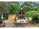 Charming A-frame home with a spacious deck, perfect for outdoor entertaining in a wooded setting at 3620 Beaver Cove Rd, Cumming, GA 30041