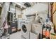 Functional laundry room with washer, dryer, sink, and storage for cleaning supplies at 3620 Beaver Cove Rd, Cumming, GA 30041