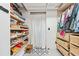 Well-organized walk-in closet features shelving, drawers, and ample storage for accessories at 3620 Beaver Cove Rd, Cumming, GA 30041