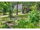 Wooded A-frame house with a peaceful garden and natural surroundings at 3620 Beaver Cove Rd, Cumming, GA 30041