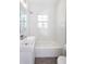 Bright bathroom featuring new fixtures, vanity, and bathtub at 469 Mellview Sw Ave, Atlanta, GA 30310