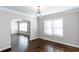 Dining area with hardwood floors, modern lighting, and access to other rooms of the home at 469 Mellview Sw Ave, Atlanta, GA 30310