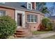 Lovely brick home with black door, detailed trim, and brick steps, offering classic charm and curb appeal at 469 Mellview Sw Ave, Atlanta, GA 30310