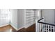 Hallway featuring hardwood floors, built in shelves, and sunlight at 469 Mellview Sw Ave, Atlanta, GA 30310