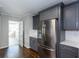 Updated kitchen featuring stainless steel appliances, shaker cabinets, and white subway tile backsplash at 469 Mellview Sw Ave, Atlanta, GA 30310