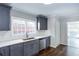 Modern kitchen with gray cabinets, stainless steel appliances, and subway tile backsplash at 469 Mellview Sw Ave, Atlanta, GA 30310