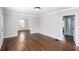 Open living space featuring hardwood floors, light gray walls, and access to other rooms at 469 Mellview Sw Ave, Atlanta, GA 30310