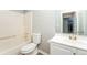 Bathroom with a tub, shower combination, white vanity, and a sleek frameless mirror at 5354 Cherry Wood Drive Dr, Stone Mountain, GA 30083