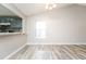 Open-concept living room showcasing a view of the kitchen area and natural light at 5354 Cherry Wood Drive Dr, Stone Mountain, GA 30083