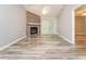 Bright living room featuring a fireplace, sliding glass door, and light-colored flooring at 5354 Cherry Wood Drive Dr, Stone Mountain, GA 30083