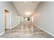 Spacious living room with modern flooring, connecting seamlessly to the kitchen and dining area at 5354 Cherry Wood Drive Dr, Stone Mountain, GA 30083