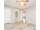 Inviting main bedroom featuring a ceiling fan, en suite bathroom, and stylish flooring at 5354 Cherry Wood Drive Dr, Stone Mountain, GA 30083