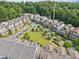Aerial view of a community of beautiful homes with mature trees and landscaping at 2111 Bellrick Nw Rd, Atlanta, GA 30318