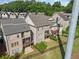 Aerial view of a gray brick two story home with a fenced in backyard and a wooden deck on the second floor at 2111 Bellrick Nw Rd, Atlanta, GA 30318