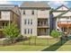 Back exterior view of a beautiful two story home, with a deck on the second story and fenced in yard at 2111 Bellrick Nw Rd, Atlanta, GA 30318