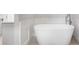 Bathroom featuring a soaking tub with wainscotting at 2111 Bellrick Nw Rd, Atlanta, GA 30318